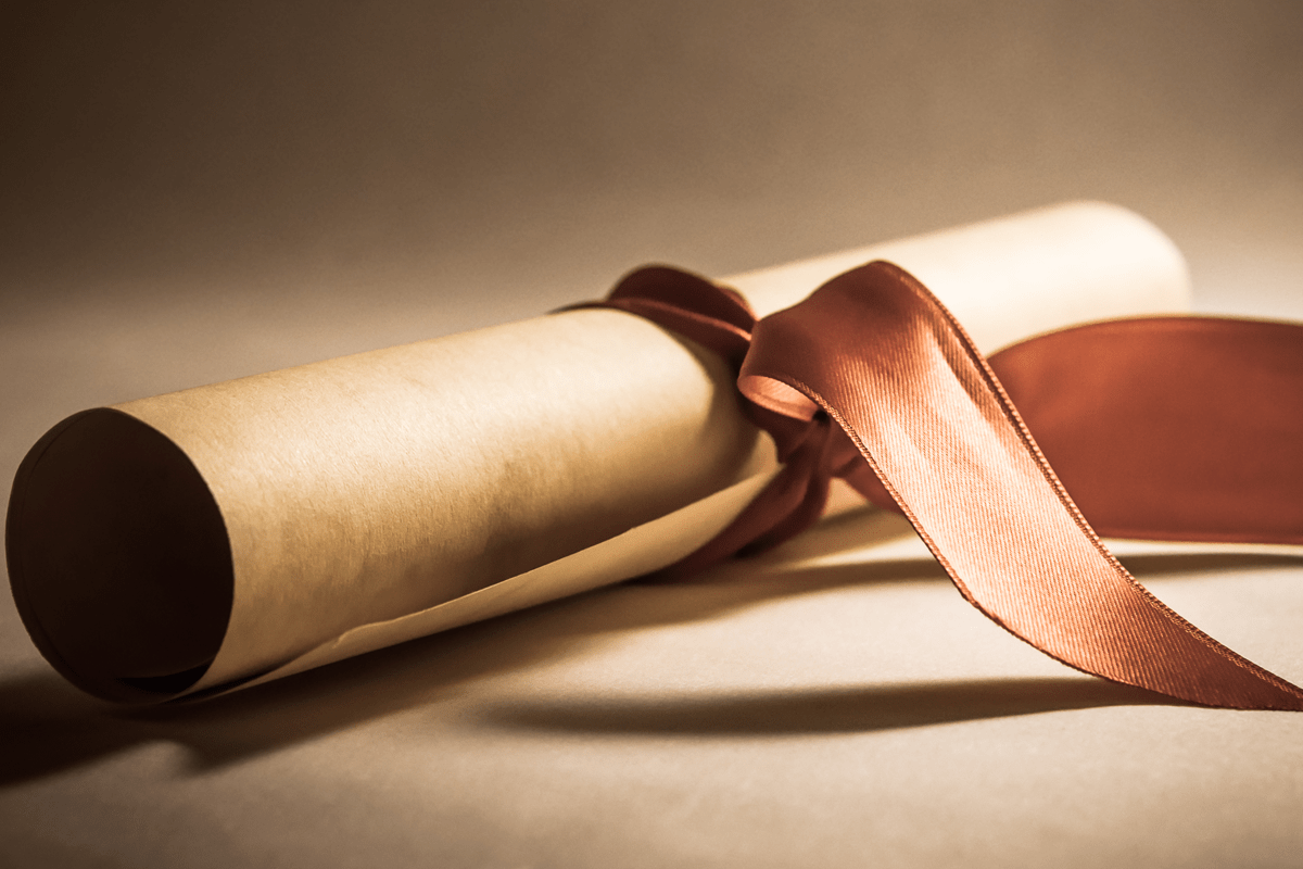 Scroll of paper with ribbon tied around