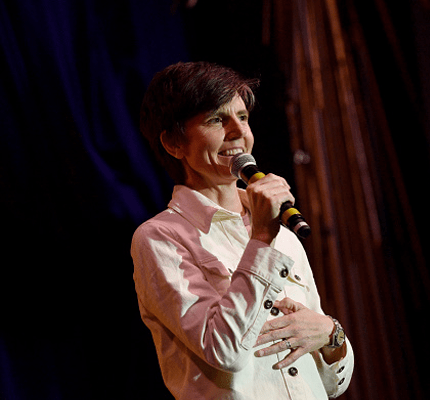 Tig Notaro on stage holding microphone