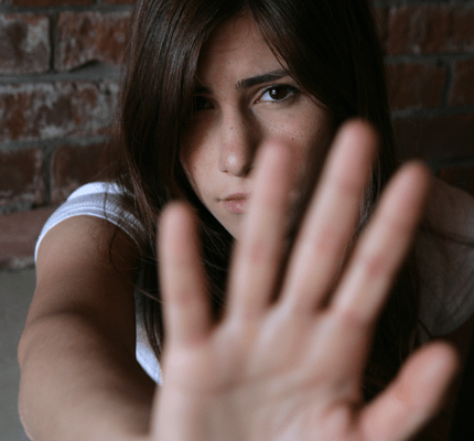 Young woman with hand up
