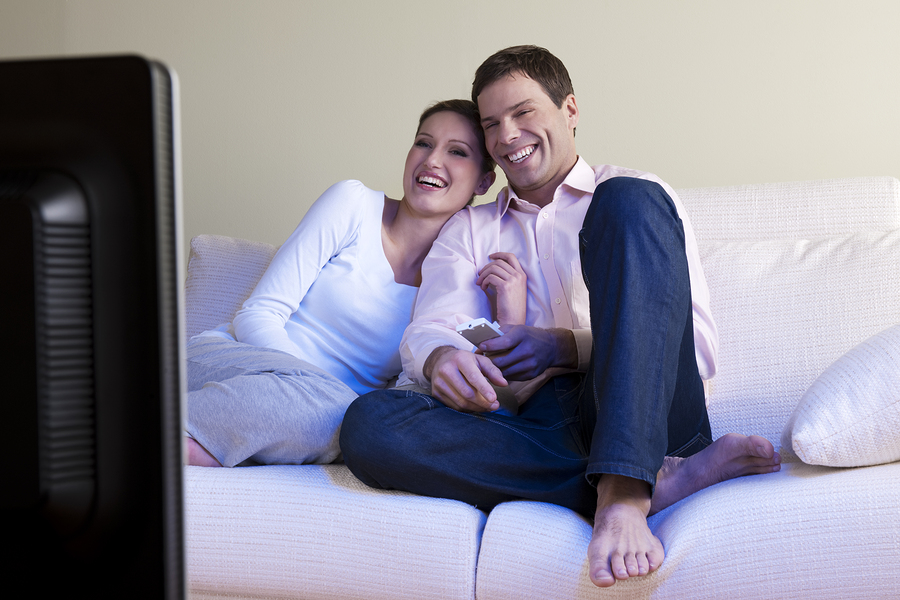 bigstock-Relaxed-couple-watching-TV-se-27544964
