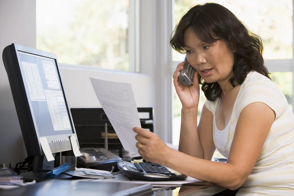 photo - woman on phone complaining